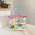Rainbow woven picnic tote bag with pink sunflower and colorful plastic checkered patterns - Sunflower Bow Decoration / Clear Multicolor