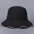 Detailed macro view of black knit sun hat with decorative white scalloped wave edge - M(56-58cm) / Black