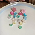 Pink and multi-color floral tassel drop earrings with delicate resin petals on a tray - Silver Earring Post Multicolor Flower Long Style