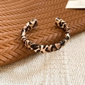 Detailed view of the leopard print pattern and faux leather texture on the open cuff bracelet - Leopard Print Narrow Style / Brown