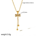 Détail du collier nœud en or 18k avec pendentifs à pompons et mesures techniques - |tn3364