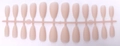 Detail view of matte nude pink almond press-on nails on a plastic factory strip - Matte Nude Pink (SDM-07)