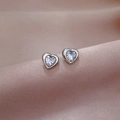 Detailed close-up of silver titanium steel heart stud earrings with sparkling clear zircon - Non-fading Titanium Steel Style / Steel
