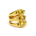 Detailed view of three-piece gold-plated titanium rings with yellow oval zircon stones - Gold Yellow Zirconia
