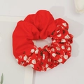 Detail of red Christmas scrunchie with Santa Claus patterns and HO HO text print - Christmas Print 08# Red (Santa Head HO)
