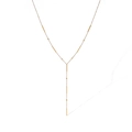 Detail of elegant gold-plated Y-shaped necklace with bar and bead charm chain elements - Gold Butterfly Round Bead Style - 24775