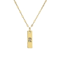 Macro shot of gold plated pendant with colorful crystals forming the letter R on a chain - Letter R
