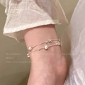 Double-layered silver anklet with star charms and matte beads on female ankle - S617 Silver - Double Layer Silver Bracelet