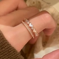 Close-up of double-layer rose gold ring with heart-shaped mother of pearl and zircons - Adjustable (Open) / Rose Gold