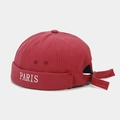 Detail view of red Miki Hat featuring PARIS embroidery and adjustable back strap buckle - Burgundy