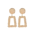 Detailed view of textured gold geometric earrings featuring round discs and rectangular frames - Trapezoid Alloy Earrings / Gold