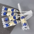 Detailed view of blue soap roses and plush bears in elegant gift packaging for Valentine - Blue