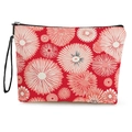 Floral makeup bag in red fabric with white flower patterns and black zipper closure - Radial Flowers On Red Background