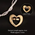 Elegant gold hollow heart hair clip with spring fastener shown in front and back view - Glossy Gold Heart Spring Clip