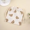 Detail of cotton muslin drawstring storage bag with cute brown bear prints and texture - Bear