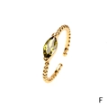 Adjustable gold beaded ring featuring a marquise-cut olive green gemstone - Olive Green Marquise / Adjustable Open