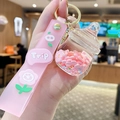 Milk bottle keychain with pink liquid glitter, stars, and cute cartoon pig wrist strap - Pink Flower - Baby Bottle