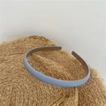 Sky blue fabric wrapped thin headband for women displayed on a woven straw hat - Light Blue