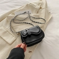 Minimalist black leather saddle bag with asymmetric flap and woven chain strap - Black