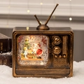 Vintage TV Christmas music box with Santa snow globe and warm festive lighting - TV Santa and Child