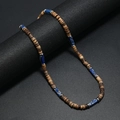 Detail of vintage bohemian necklace with brown coconut beads and blue natural stone accents - Royal Blue