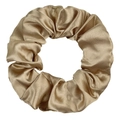 Detailed view of large champagne gold satin silk scrunchie with smooth glossy texture - Camel