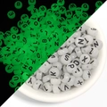 Luminous acrylic alphabet beads for DIY bracelets shown in daylight and glowing in the dark - Luminous + White/Black Text