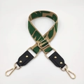 Close-up of adjustable khaki and green woven strap with black leather and gold hardware - No.7 Dark Green Jacquard + Black Leather