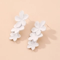 Detail view of elegant triple matte white flower earrings with silver studs and metal base - White Flower Earrings (925 Silver Needle)