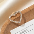 Close-up of gold heart-shaped charm with pavé crystals for DIY jewelry making - Large Hollow Heart