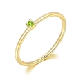 Minimalist gold plated ring featuring a sparkling round green peridot gemstone - US 5 / Light Gold + Dark Apple Green Stone