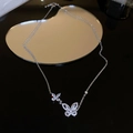 Detail of silver double butterfly necklace with sparkling crystals on mirror surface - Necklace Style 44 / Silver