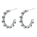 Detailed view of C-shaped earrings with inlaid green zircons in silver finish - Platinum Green Zirconia