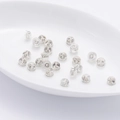 Silicone earring backs with metal core inserts shown scattered on white tray - 925 Silver / Platinum/Pair (Half Wrapped)