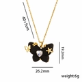 Collier papillon en acier titane avec cœur en zircone et étoiles en finition dorée - Noir