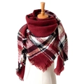 Classic red, black and white plaid scarf with fringe on a wooden mannequin display - Bright Red Plaid