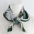 Detail of elegant silk scarf with green and black geometric patterns on a neck model - Green / 70x70cm