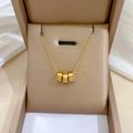 Collana minimalista in oro titanio con tre ciondoli a cilindro con numeri romani - Cilindro Numeri Romani Oro (N114)