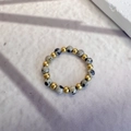 Macro detail of natural dalmatian jasper beads and gold metal beads on elastic ring - Elastic (Circumference 60mm) / Spotted (Dalmatian Jasper)