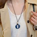 Collier rétro Maillard avec anneau en résine marbré bleu foncé et cordon noir - 14# Collier-Bleu