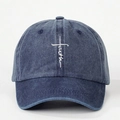 Navy blue washed cotton baseball cap with white faith cross embroidery on a plain background - Navy Blue