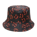 Detailed view of black bucket hat featuring orange Halloween monster print and stitching - M (56-58cm) / Black Background Orange Monster Face (H)