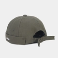 Detail of army green docker cap with small white fish embroidery and metal buckle - Army Green