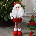 Père Noël en peluche debout avec longues jambes télescopiques et bonnet rouge à pois - Père Noël