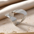 Close-up of a silver wavy stainless steel ring with elegant streamlined texture details - Silver Twisted Wave Ring