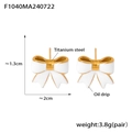 White oil drip bow earrings in 18k gold plated titanium steel measuring 1.3cm by 2cm - Gold White