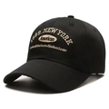 Detail of black baseball cap with vintage New York 1989 embroidery on cotton fabric - Black