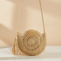 Round woven straw shoulder bag with elegant tassel detail for summer beach vacations - Off White