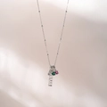 Detail of silver chain necklace with smile pendant, green and pink zircon stones - SMILE Letters / Palladium White
