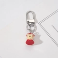 Detailed view of apple core pendant with silver metal keychain on a white background - Apple Core